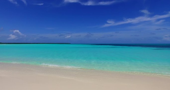 astonishing view exotic island beach in Thailand under the bright sky wit white clouds, ,coral reef and beautiful crystal clear water