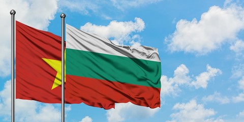 Vietnam and Bulgaria flag waving in the wind against white cloudy blue sky together. Diplomacy concept, international relations.