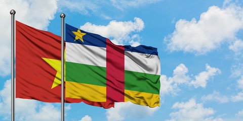 Vietnam and Central African Republic flag waving in the wind against white cloudy blue sky together. Diplomacy concept, international relations.