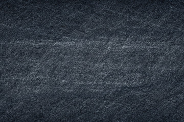 Dark grey black slate stone background or texture.