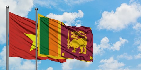 Vietnam and Sri Lanka flag waving in the wind against white cloudy blue sky together. Diplomacy concept, international relations.
