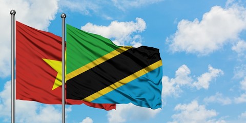 Vietnam and Tanzania flag waving in the wind against white cloudy blue sky together. Diplomacy concept, international relations.