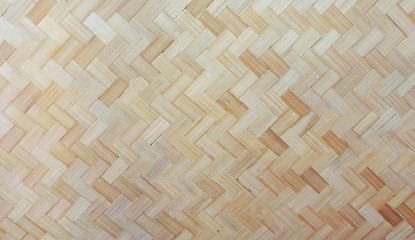 Pattern and style of weaving background, natural material weaving background pattern, traditional style of weaving sheet in light brown color use for background pattern, old style nature weaving wall