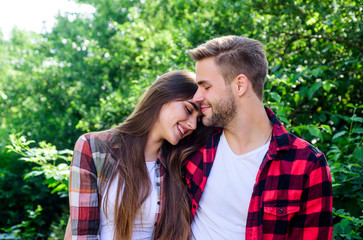 Fototapeta premium Man hipster and pretty woman in love. Summer vacation. Fall in love. Pure feelings. Romantic date concept. Beautiful people. Happy together. Couple in love. Enjoying each other. Cuddling with darling