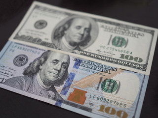 old and new 100 dollar banknote closeup top view