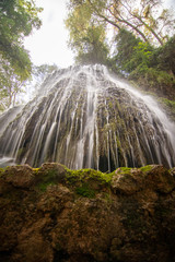 Obraz premium river with waterfall in the autumn season