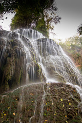 Fototapeta premium river with waterfall in the autumn season