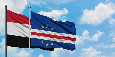 Yemen and Cape Verde flag waving in the wind against white cloudy blue sky together. Diplomacy concept, international relations.