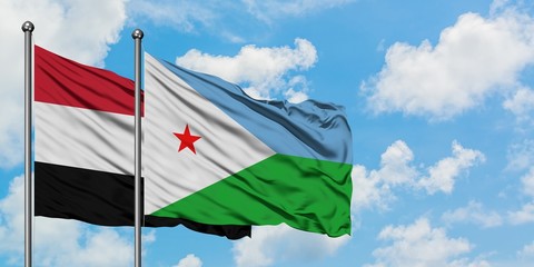 Yemen and Djibouti flag waving in the wind against white cloudy blue sky together. Diplomacy concept, international relations.