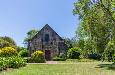 Fototapeta na wymiar Small Stone Chapel Abbey Building Church Summer Garden Landscape