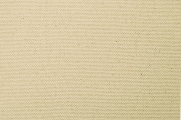 Hessian sackcloth woven texture pattern background in light yellow cream brown