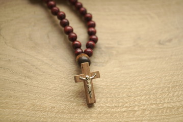 rosary on a wooden background