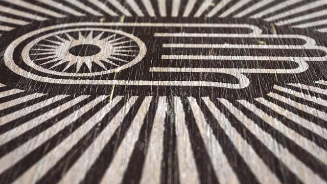 Hand With Wheel - Jain Symbol On Wodden Texture. Ideal For Your Jainism / Religion Related Projects. High Quality Seamless Animation. 1080p, 60fps