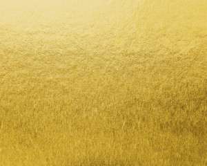 Gold foil leaf shiny wrapping paper texture background for wall paper decoration element