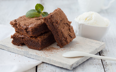 White isolated background with clipping paths homemade dark chocolate brownies and mint delicious...