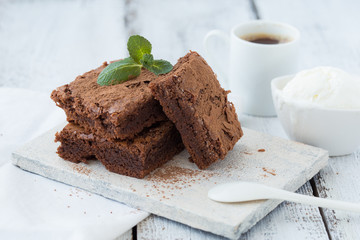 White isolated background with clipping paths homemade dark chocolate brownies and mint delicious bitter sweet and fudge. Brownie is one type of chocolate cake.Vintage tone.