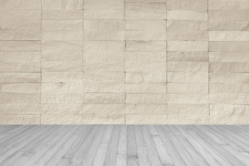 Rock tile wall in light cream beige brown color with wooden floor in dark grey