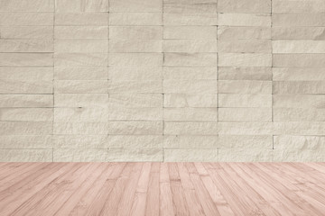 Beige cream rock tile wall with wooden floor in red brown color for interior background