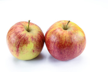 yellow and red apple on a white background