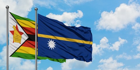 Zimbabwe and Nauru flag waving in the wind against white cloudy blue sky together. Diplomacy concept, international relations.