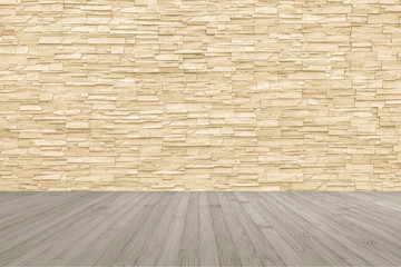 Limestone rock tile wall backdrop in yellow cream brown color tone with wooden floor in light sepia colour