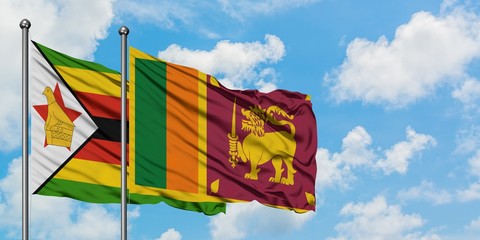 Zimbabwe and Sri Lanka flag waving in the wind against white cloudy blue sky together. Diplomacy concept, international relations.