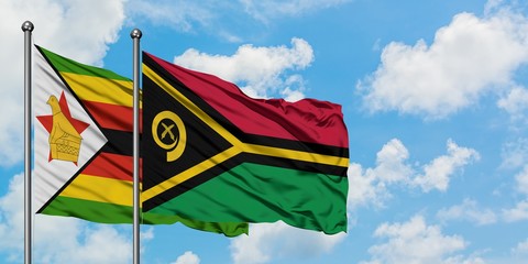 Zimbabwe and Vanuatu flag waving in the wind against white cloudy blue sky together. Diplomacy concept, international relations.