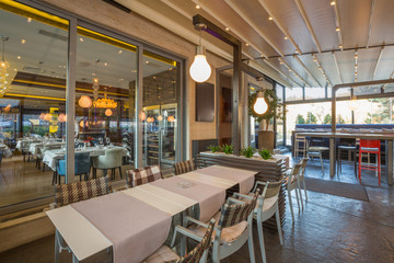 Fototapeta na wymiar Restaurant with large open garden interior
