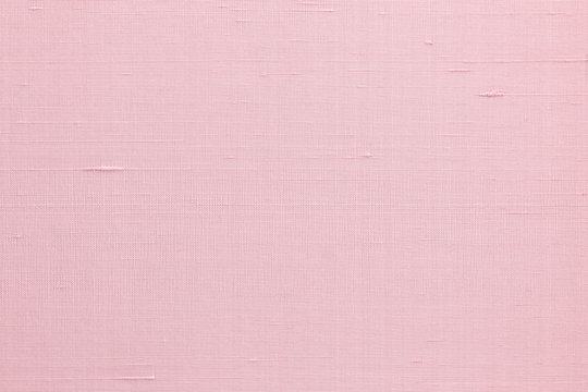 Pink silk fabric wallpaper texture pattern background in light pale sweet pink rose color