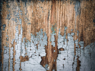 old wooden background, peeling white paint on a wood wall
