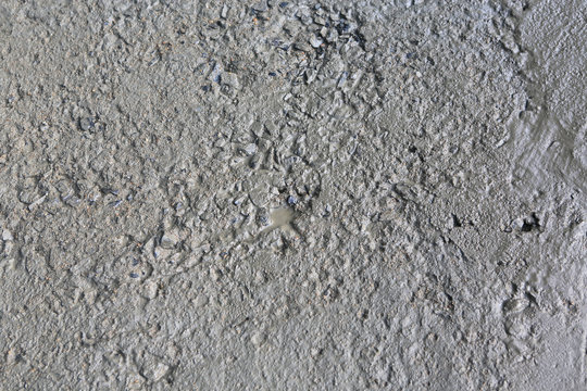 Wet cement texture of construction for background.