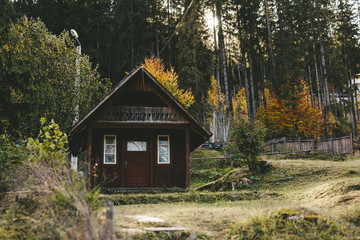 Traditional small houses in the forest in the mountains