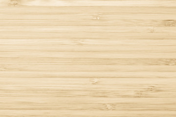 Bamboo wood texture background in natural yellow cream color.