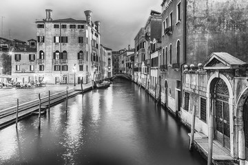 Fototapeta premium View over a picturesque canal at night in Venice, Italy