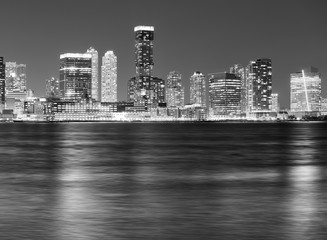 Black and white picture of Jersey City skyline at night.