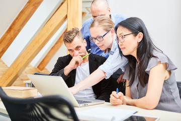 Start-up team at the laptop brainstorming