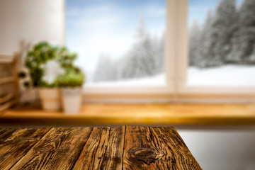 Wooden desk of free space and winter window sill