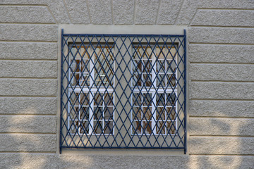 Old window with low blind on covered.