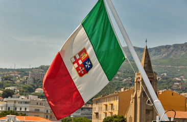 Italian flag with Bastia cityscape. Corsica, France.
