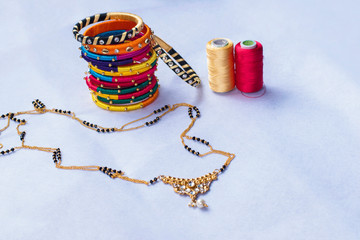 Traditional Indian thread bangles, silk thread earrings and Mangal sutra