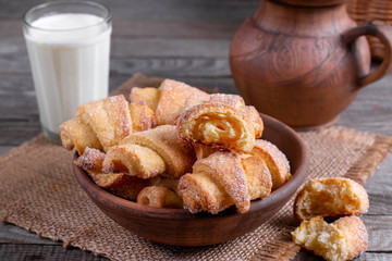 Tasty baked rolled or bagels cookies with sugar