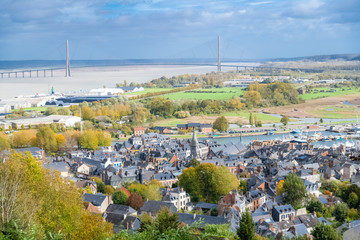Honfleur in Normandy, aerial view of the city, with the Normandy bridge in background - obrazy, fototapety, plakaty