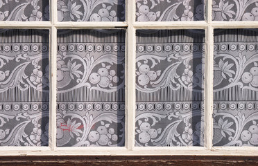 window panes with lace curtain