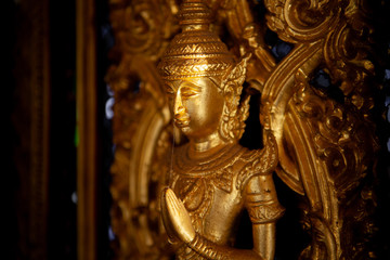 Fototapeta na wymiar Close-up of Golden ancient thai craft art