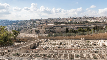View of the Jewish cemetery, the Temple Mount, the old and modern city of Jerusalem from Mount Eleon - Mount of Olives in East Jerusalem in Israel
