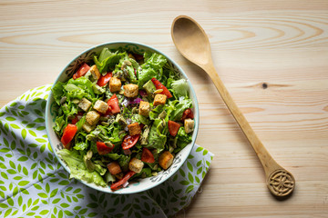 salad with tomatoes and avocado, top-view