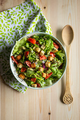 salad with tomatoes and avocado, top-view vertical