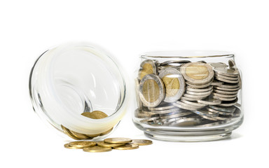 coins in glass bottle on white background,business saving and investment concept