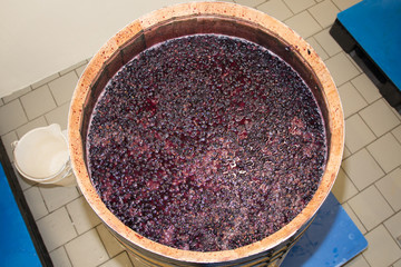 red grapes juice squeezed grape in wooden barrel harvest