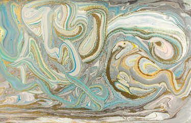 Pale blue marble pattern with golden glitter. Abstract liquid background.